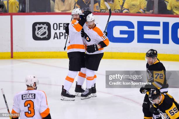 Philadelphia Flyers center Sean Couturier celebrates his goal with Philadelphia Flyers left wing Michael Raffl during the second period in Game Two...