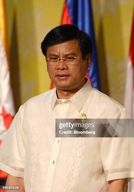 Bouasone Bouphavanh, prime minister of Laos, waits for a photo session during the Second East Asia Summit at the Cebu International Convention Center...