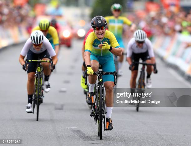 Chloe Hosking of Australia celebrates victory in the Women's Road Race on day 10 of the Gold Coast 2018 Commonwealth Games at Currumbin Beachfront on...