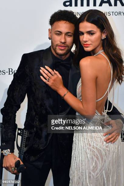 Brazilian PSG's footballer Neymar Junior and girlfriend Bruna Marquezine attend the photocall for the 2018 American Foundation for AIDS Research Gala...