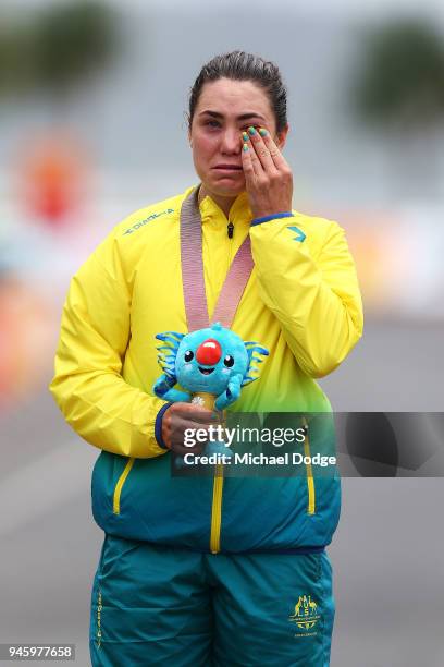 Gold medalist Chloe Hosking of Australia shows her emotion during the medal ceremony for the Women's Road Race on day 10 of the Gold Coast 2018...