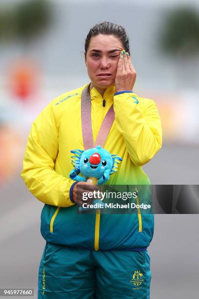 Gold medalist Chloe Hosking of Australia shows her emotion during the medal ceremony for the Women's Road Race on day 10 of the Gold Coast 2018...