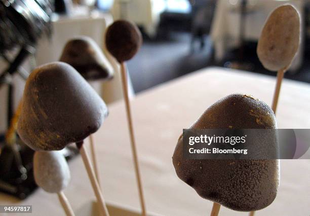 Chocolate-coated fruit perched on long sticks, resembling mushrooms, is served at the Schwarzwaldstube restaurant in the Traube Tonbach hotel in...