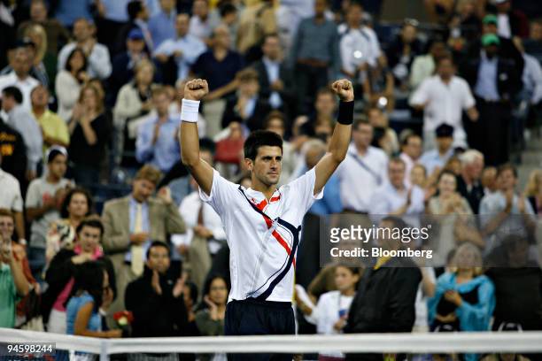Novak Djokovic of Serbia raises his fists following his victory over Carlos Moya of Spain during their quarter final match on day eleven of the U.S....
