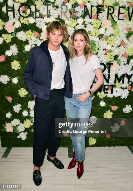 Model Jordan Barrett and Global Ambassador of Knot On My Planet Doutzen Kroes attend a personal appearance at Holt Renfrew flag on April 13, 2018 in...