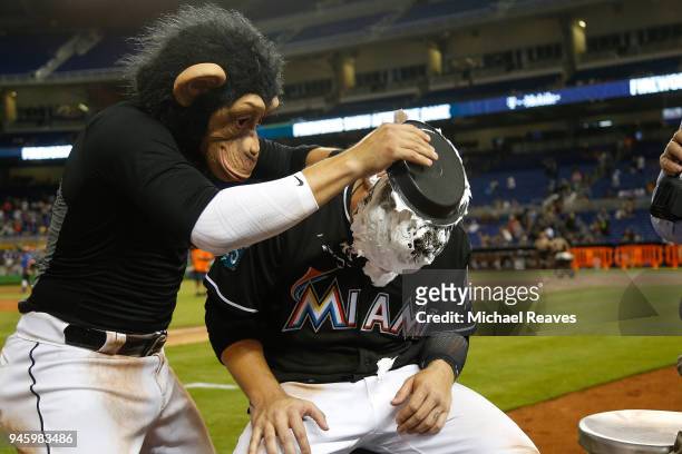 Miguel Rojas of the Miami Marlins pies J.B. Shuck after they defeated the Pittsburgh Pirates at Marlins Park on April 13, 2018 in Miami, Florida.