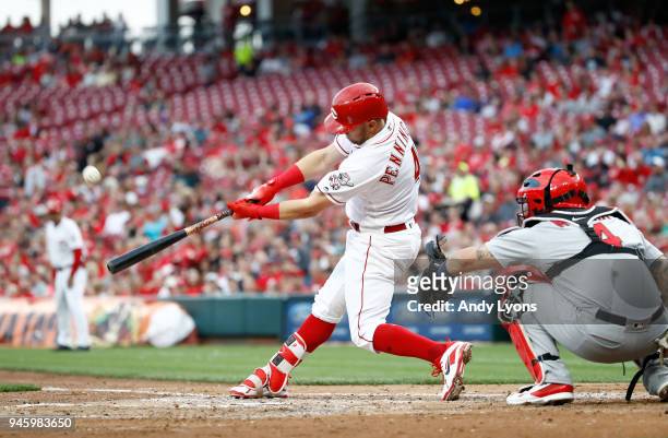 Cliff Pennington of the Cincinnati Reds hits the ball in the third inning against the St. Louis Cardinals at Great American Ball Park on April 13,...