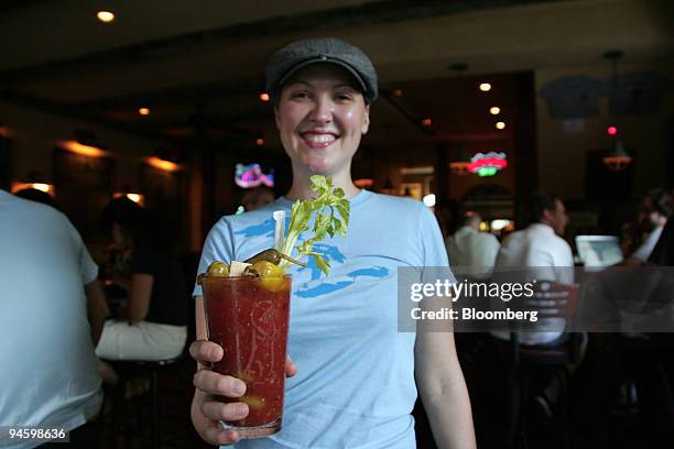 Louise Leonard, a bartender at The Blind Tiger, shows off her signature creation, "Louise's World Famous Bloody Beer," a cocktail made with tomato...