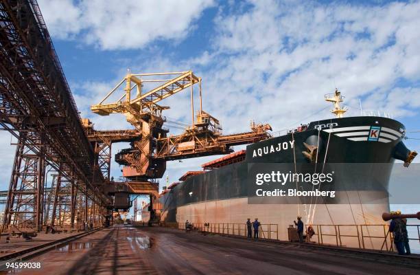 Iron ore is loaded onto a freighter at the Ponta da Madeira Maritime Terminal, owned by mining company CVRD in the state of Maranhao, in northern...