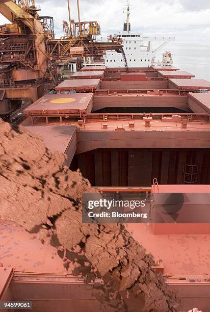 Iron ore is loaded onto a freighter at the Ponta da Madeira Maritime Terminal, owned by mining company CVRD in the state of Maranhao, in northern...