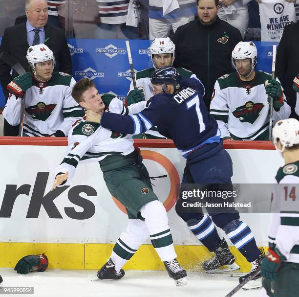 Ben Chiarot of the Winnipeg Jets fights Nick Seeler of the Minnesota Wild in Game Two of the Western Conference First Round during the 2018 NHL...