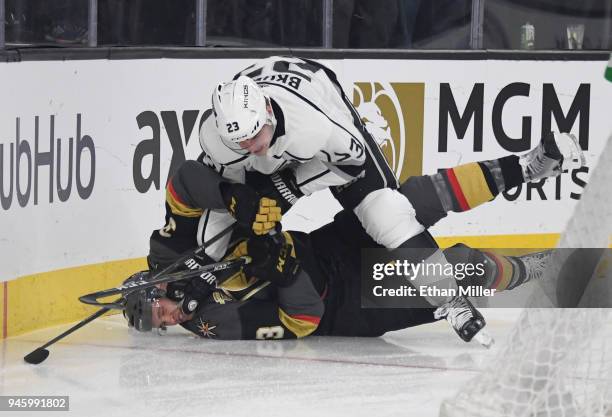 Dustin Brown of the Los Angeles Kings shoves Brayden McNabb of the Vegas Golden Knights down on the ice in the first period of Game Two of the...