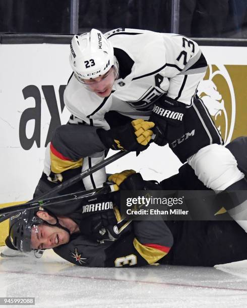 Dustin Brown of the Los Angeles Kings shoves Brayden McNabb of the Vegas Golden Knights down on the ice in the first period of Game Two of the...