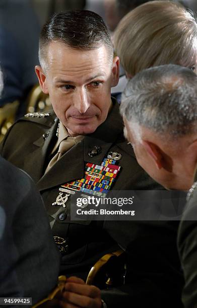 Chairman of the Joint Chiefs of Staff General Peter Pace, left, talks with Marine Corps Commandant General James Conway before a ceremony with...