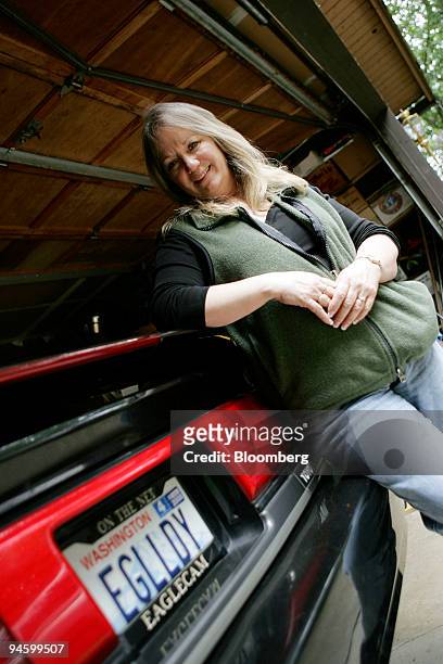 Loraine Robbins poses with her car bearing the license plate 'EGLLDY' at her home in Kent, Washington, Friday, June 29, 2007. Robbins has the nest of...