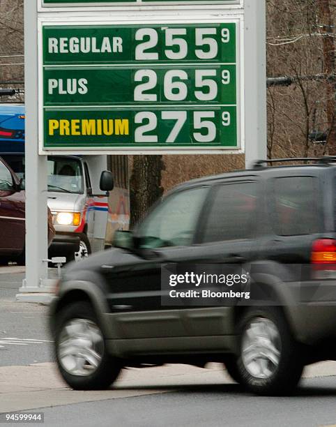 Gas prices are displayed above a passing vehicle in Shillington, Pennsylvania, Tuesday, March 13, 2007. Retail sales in the U.S. Rose less than...