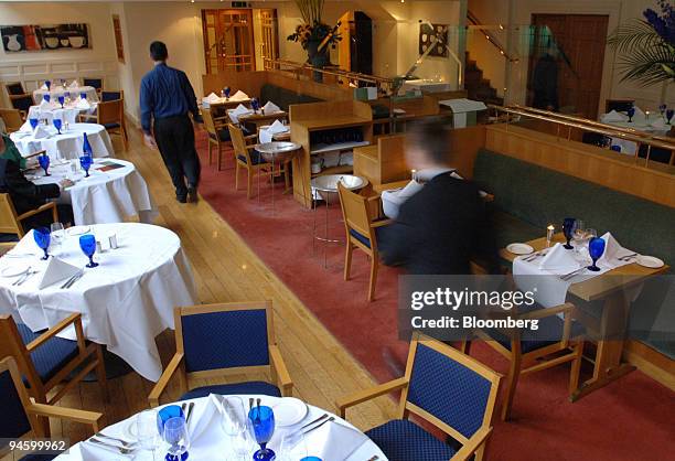 Staff make preparations for the day ahead in the Clarence Tea Room restaurant in the Clarence Hotel on Essex Street in Dublin, on Wednesday, Sept. 6,...