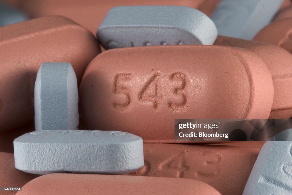 Tablets of Zocor generic Simvastatin (orange) and Zoloft gen