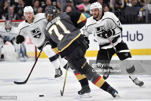 William Karlsson of the Vegas Golden Knights skates with the puck while Torrey Mitchell of the Los Angeles Kings defends in Game Two of the Western...