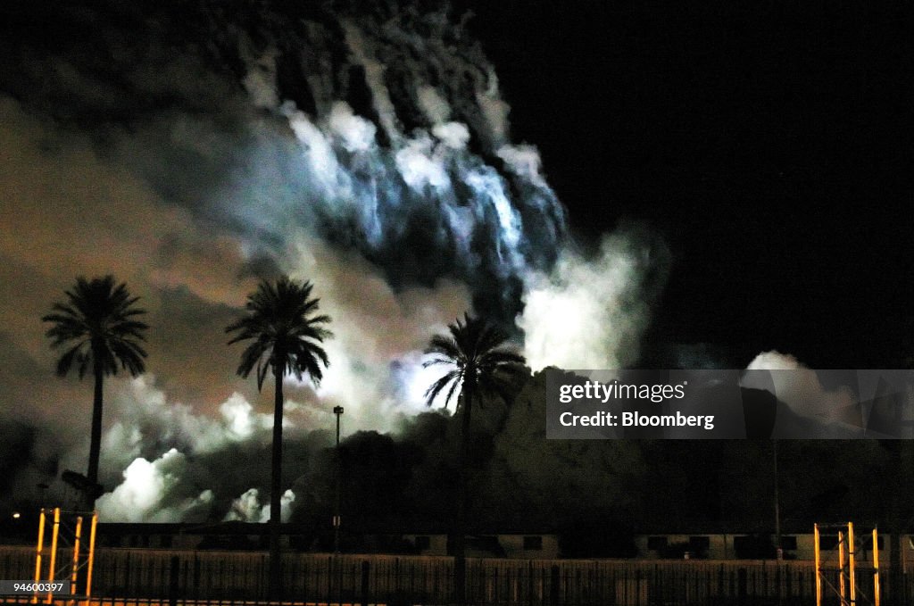 Dust and smoke rise from the site of the Stardust Resort and
