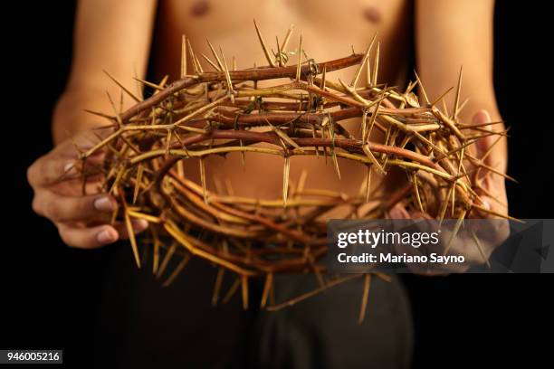 man holding a crown of thorns - asian man covering ears stock pictures, royalty-free photos & images