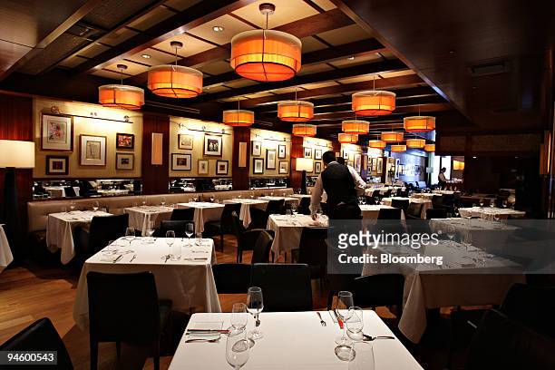 Staff prepare the second floor dining room of Fiamma in New York, U.S., on Monday, Oct. 8, 2007. Fiamma, an expensive Manhattan eatery run by...