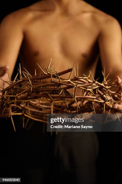 man holding a crown of thorns - asian man covering ears stock pictures, royalty-free photos & images
