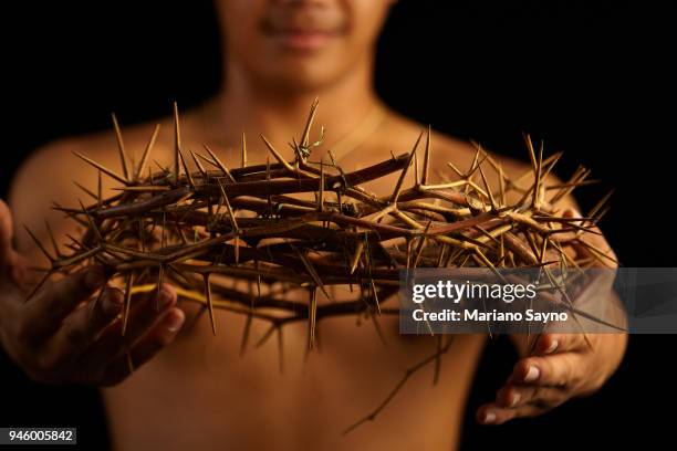 man holding a crown of thorns - asian man covering ears stock pictures, royalty-free photos & images