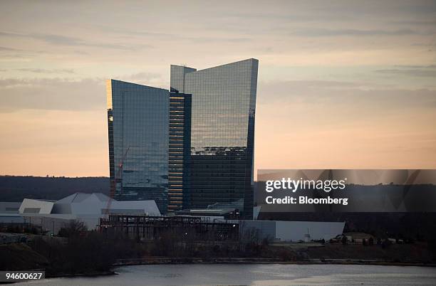 The sun sets behind the Mohegan Sun casino in Uncasville, Connecticut, on Sunday, Jan. 13, 2008. Bondholders in Connecticut's Mohegan Sun and...