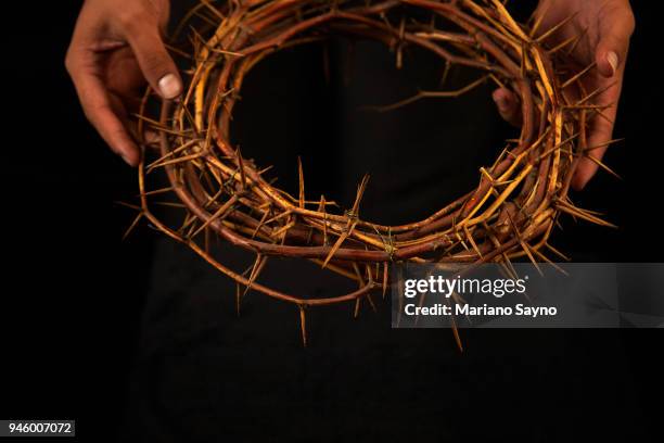 man holding a crown of thorns - asian man covering ears stock pictures, royalty-free photos & images