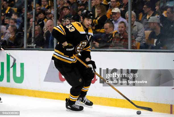 Boston Bruins left defenseman Zdeno Chara looks to clear the puck during Game 1 of the First Round for the 2018 Stanley Cup Playoffs between the...