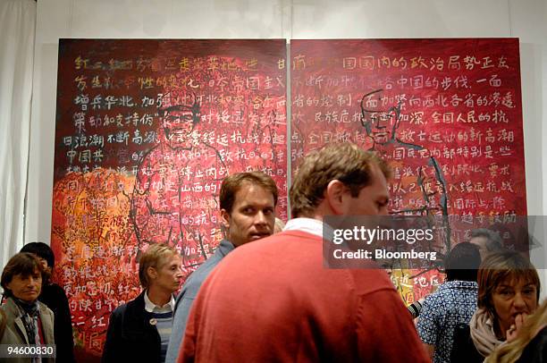 Visitors gather at 10 Chancery Lane Gallery during Hong Kong Art Walk, March 7 in Hong Kong, China. One night a year, the Hong Kong ArtWalk draws...