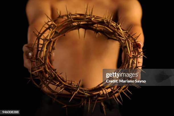 man holding a crown of thorns - asian man covering ears stock pictures, royalty-free photos & images