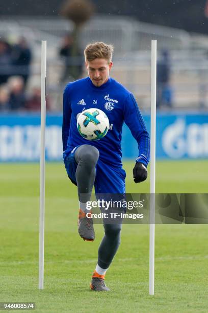 Bastian Oczipka of Schalke controls the ball during a training session at the FC Schalke 04 Training center on March 29, 2018 in Gelsenkirchen,...