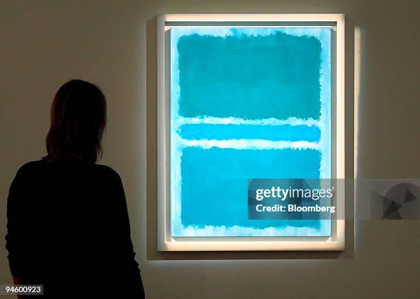 Visitor to Sotheby's October contemporary art sale highlights, looks at a work by Mark Rothko entitled 'Blue Divided By Blue' in London, U.K., on...