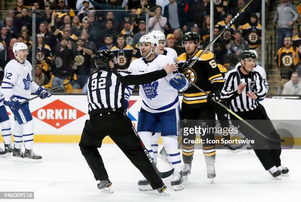 Toronto Maple Leafs center Nazem Kadri argues his boarding call as linesman Mark Shewchyk moves in during Game 1 of the First Round for the 2018...