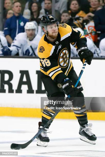 Boston Bruins right wing David Pastrnak passes the puck during Game 1 of the First Round for the 2018 Stanley Cup Playoffs between the Boston Bruins...