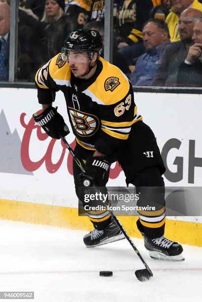 Boston Bruins left wing Brad Marchand looks for a teammate in front during Game 1 of the First Round for the 2018 Stanley Cup Playoffs between the...