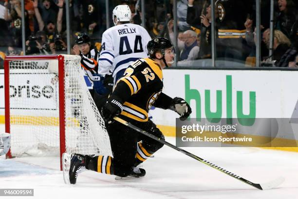 Boston Bruins center Sean Kuraly reacts to scoring during Game 1 of the First Round for the 2018 Stanley Cup Playoffs between the Boston Bruins and...