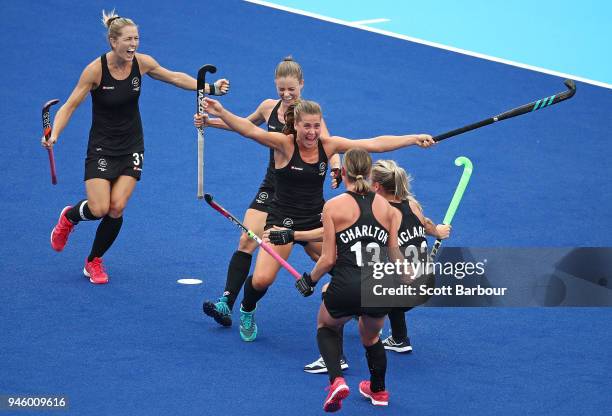 Rose Keddell of New Zealand is congratulated by her teammates after scoring their second goal during the Women's Gold Medal match between Australia...