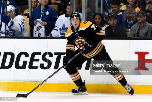 Boston Bruins right defenseman Charlie McAvoy holds the puck during Game 1 of the First Round for the 2018 Stanley Cup Playoffs between the Boston...