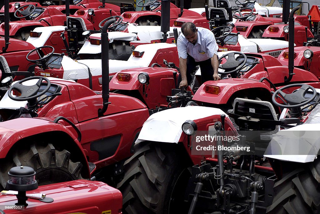 Tractors sit in a lot awaiting shipment at the Mahindra & Ma
