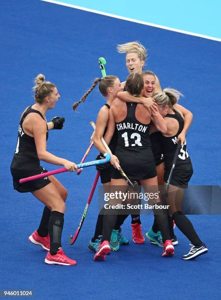 Rose Keddell of New Zealand is congratulated by her teammates after scoring their second goal during the Women's Gold Medal match between Australia...