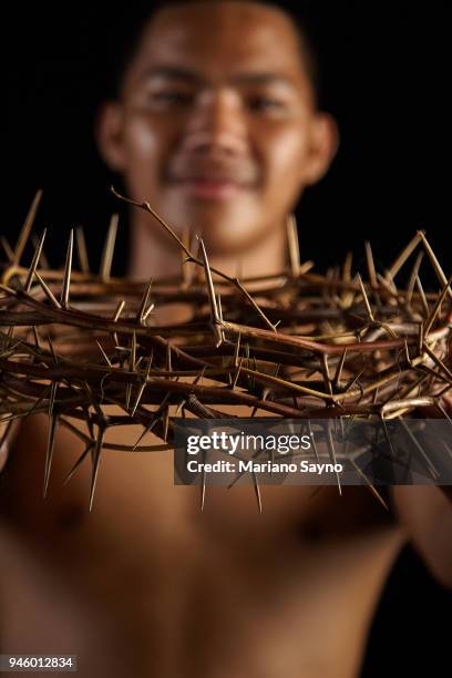 man holding a crown of thorns - asian man covering ears stock pictures, royalty-free photos & images