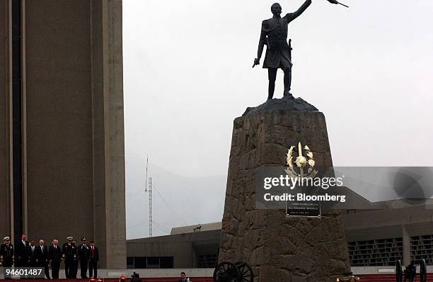 Statue of Francisco Bolognesi stands before Robert Gates, U.S. Defense secretary, as he arrives to the defense headquarters in Lima, Peru, on Friday,...