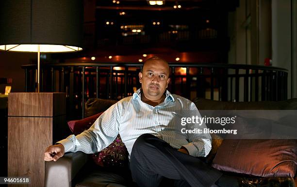 Jamal Hirani, chief executive officer of Tiffinbites, poses at one of his Indian restaurant in the financial district of London, U.K., on Tuesday,...