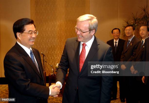 Hu Jintao, China's president, left, and Kevin Rudd, Australia's leader of the opposition Labor Party, shake hands during day six of the Asia-Pacific...