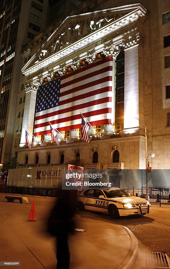 A pedestrian passes by the New York Stock Exchange in downto