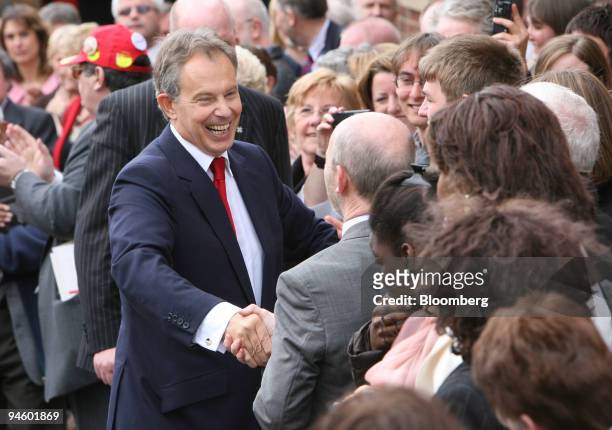 Prime Minister Tony Blair shakes hands with supporters following the announcement of his resignation at the Trimdon Labour Club in Sedgefield, U.K....