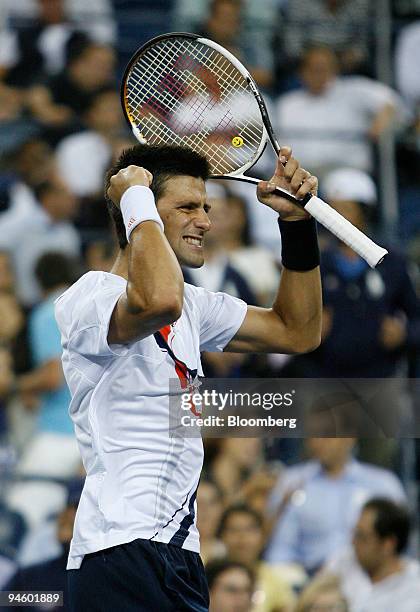 Novak Djokovic of Serbia reacts following his victory over Carlos Moya of Spain during their quarter final match on day eleven of the U.S. Open at...